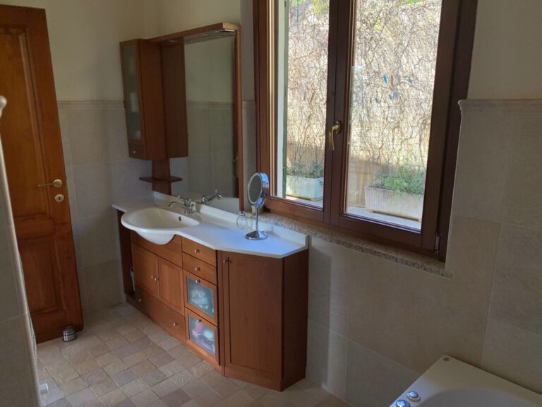 Bathroom with vanity and window