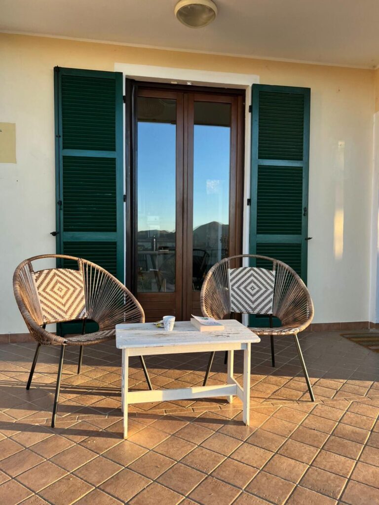 Chairs and table on the terracotta terrace