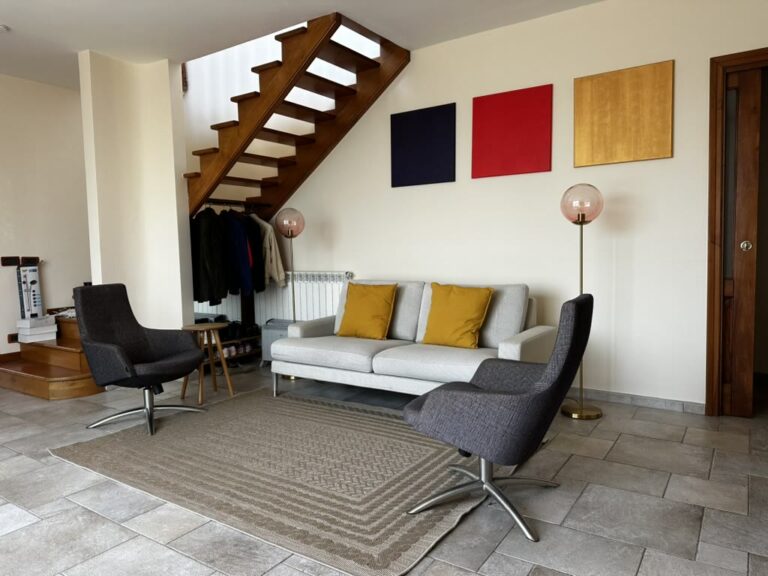 Living room with sofa and armchairs