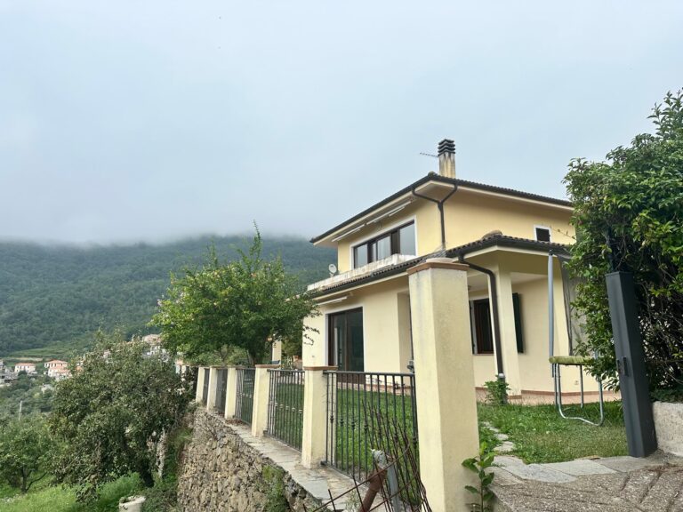 The villa with low clouds over the hills